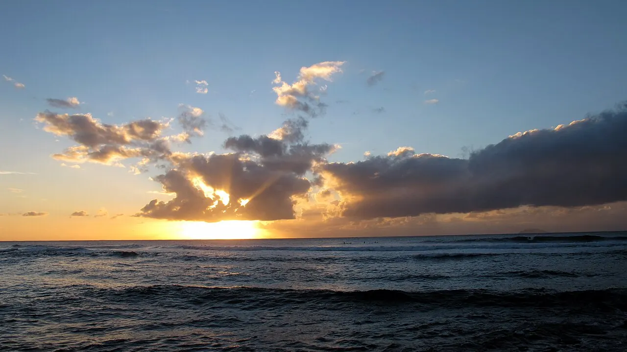 Sunset over the surf at María's Beach in Rincón